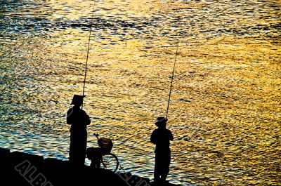 Fisherman silhouette  on shoreline