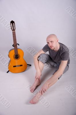 Nice bald guy with a guitar