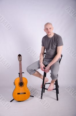 Nice bald guy with a guitar