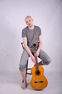 Nice bald guy with a guitar