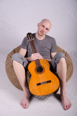 Nice bald guy with a guitar