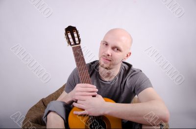 Nice bald guy with a guitar