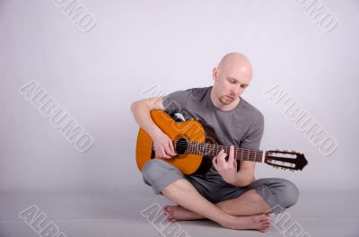 Nice bald guy with a guitar