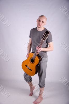 Nice bald guy with a guitar