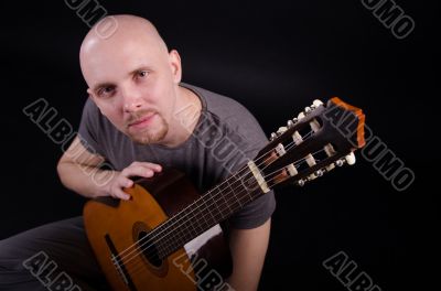 Nice bald guy with a guitar