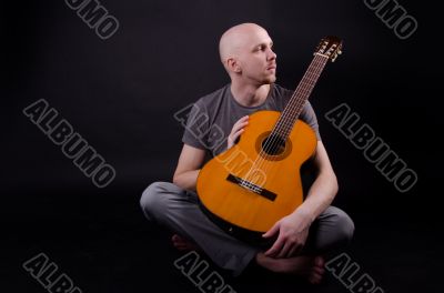 Nice bald guy with a guitar