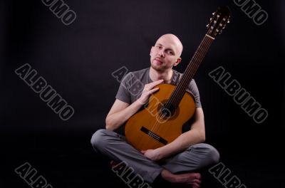 Nice bald guy with a guitar