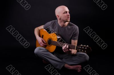 Nice bald guy with a guitar