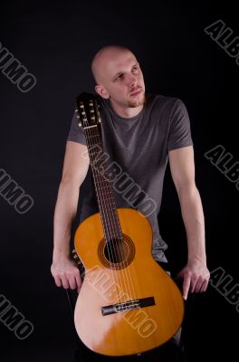 Nice bald guy with a guitar