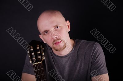 Nice bald guy with a guitar