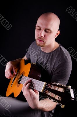 Nice bald guy with a guitar