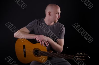 Nice bald guy with a guitar