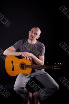 Nice bald guy with a guitar