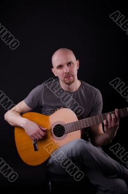 Nice bald guy with a guitar