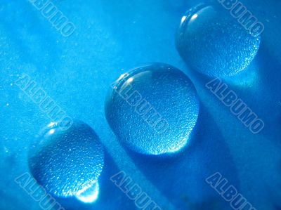Drops of water in blue