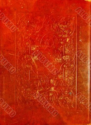 Old red leather texture with decorative frame.