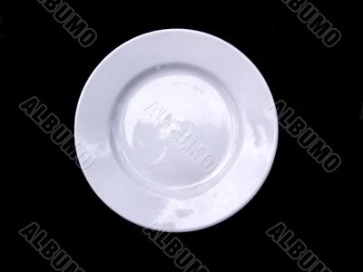 White plate isolated on a black background