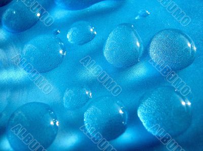 Drops of water in blue