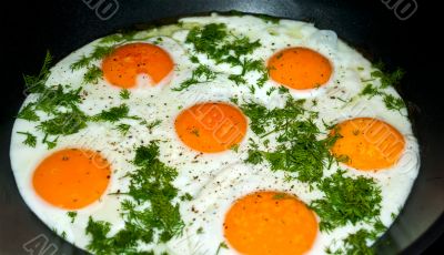 Fried eggs in a skillet.