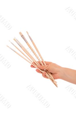 Paint brushes in hand