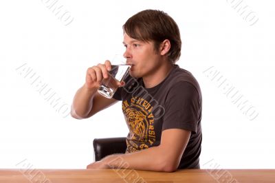 Man drinking water in a glass