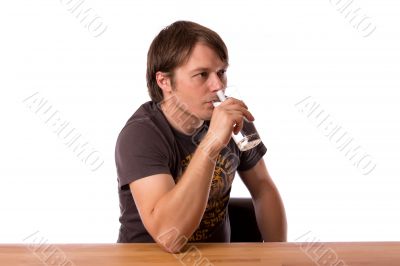 Man drinking water in a glass