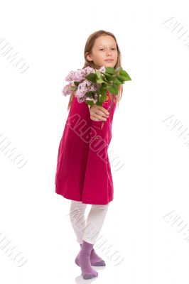 Beautiful young girl with lilac flowers
