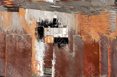 Peeling paint on rusted metal surface