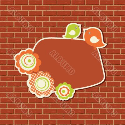 Vintage frame with two birds on the brick wall background