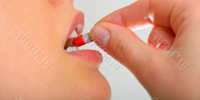 Woman taking pills