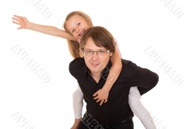 Man giving piggyback ride to a little girl