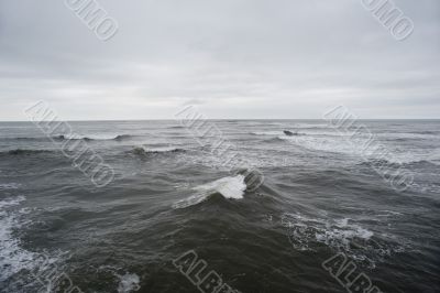 The stormy waves of the North Sea in a cloudy day