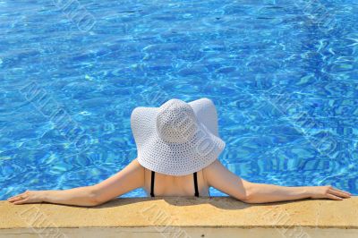 Woman with white hat relaxing 