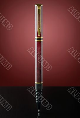 isolated red and golden pen