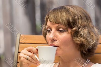 Attractive woman drinking coffee