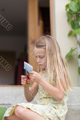  Little girl cutting paper