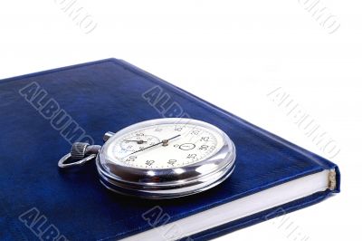 Stopwatch and the notebook on a white background