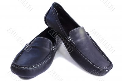 Black leather loafers on a white background.