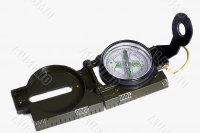 A small compass in a metal frame on a white background.