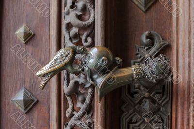 The latch on the gate of the castle Hluboka nad Vltavou