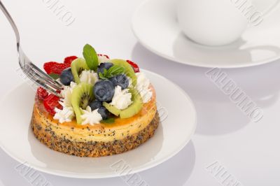 Cheese-cake, strawberries, blueberries and kiwi