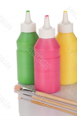Bottles of paint and pencils