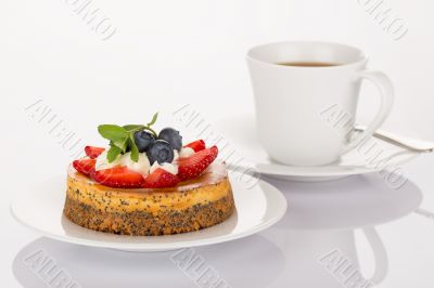 Cheesecake, cup of coffee and spoon