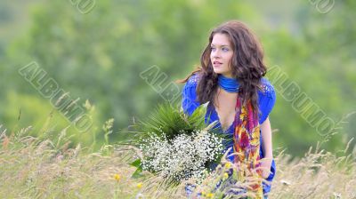 girl with bouquet  in field