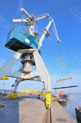 crane and steel plate in harbor