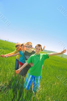 kids play in wheat field