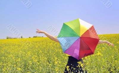 a young attractive girl with a colorful umbrella