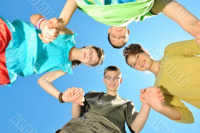 Four children against the sky