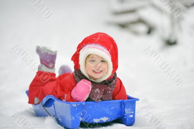 girl on sleigh