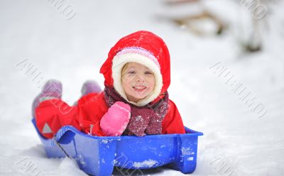 Little girl on sleigh 
